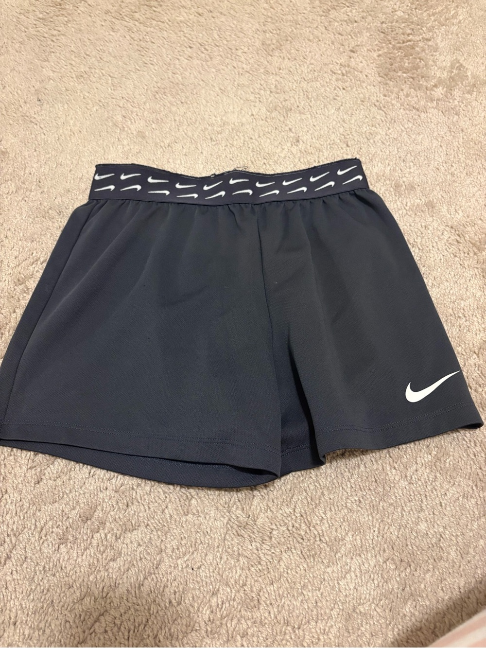 Nike Women's Black Athletic Shorts with White Swoosh and Branded Waistband